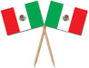 Two Mexican flags with red, white, and green stripes and central eagle emblems are crossed together on wooden picks.