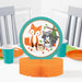 Wild One honeycomb centerpiece with fox, raccoon, hedgehog, trees, mushrooms, teal frame, and orange honeycomb base on a party table.
