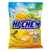 Hi-Chew Tropical Mix: soft chewy fruit candy cubes, bright tropical in color. Sold in a 3.53 oz clear plastic peg bag that hangs from a printed header card, with the candy visible inside.