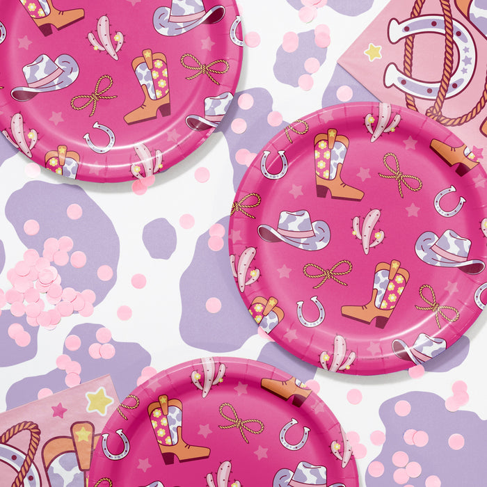 Pink paper plates with cowboy boot, hat, and horseshoe pattern on a white background.