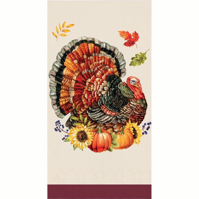 A vertical napkin featuring a detailed illustration of a turkey with fanned feathers in autumn colors, surrounded by pumpkins, sunflowers, berries, and scattered leaves on a cream background with a burgundy band at the bottom.