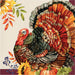 A square napkin featuring a large illustrated turkey with layered red, orange, brown, green, and gray feathers, surrounded by sunflowers, pumpkins, autumn leaves, and blue berries on a cream background with a burgundy border.
