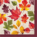 A square paper napkin featuring a colorful autumn leaf pattern on a cream background, with a solid burgundy border.