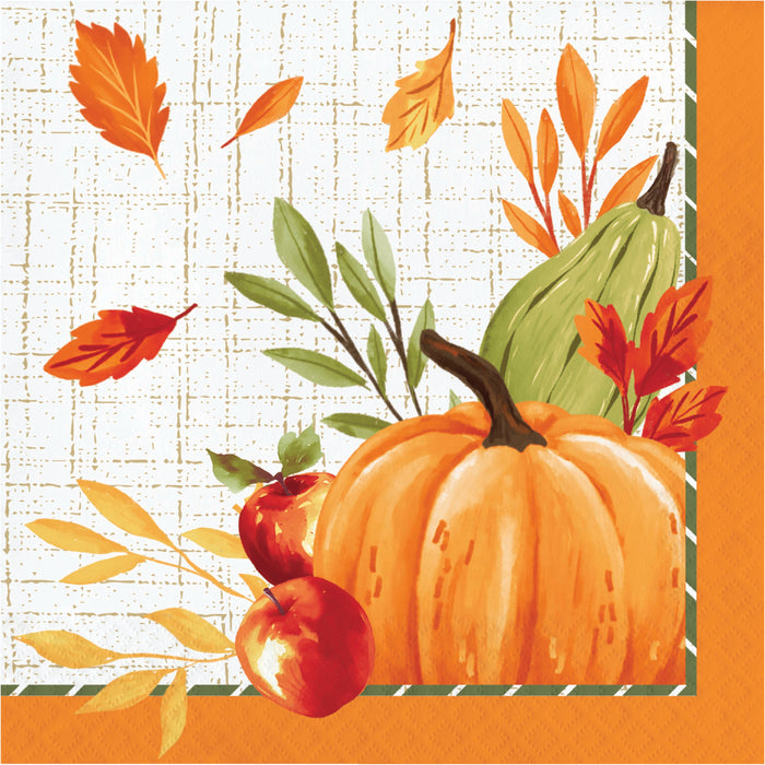 Autumn-themed paper napkin featuring a large orange pumpkin, red apples, green leaves, and orange leaves on a cream grid background with an orange border.
