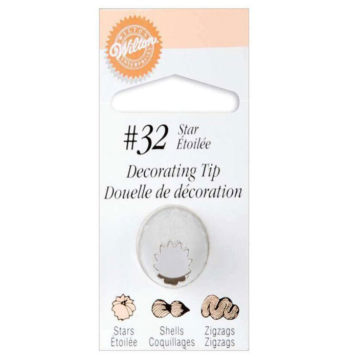 Wilton #32 Star decorating tip in white metal with packaging showing star pattern examples and bilingual labeling.