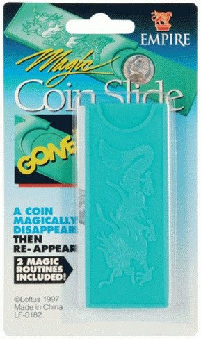 Magic Coin Slide magic trick in turquoise packaging showing a rectangular plastic slide device with coin graphics and "GONE" text, includes two magic routines.