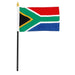 South Africa flag with red, blue, green, black, white, and gold colors featuring a centered arrow design, mounted on a black plastic stick with gold flame-shaped topper.