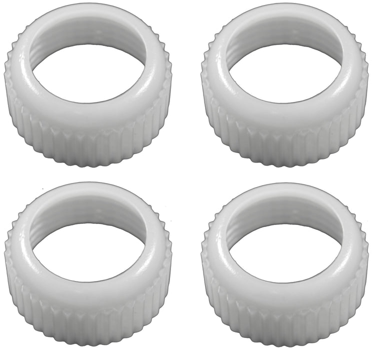 Four white plastic coupler rings with vertical ridged texture arranged in a two-by-two grid layout.