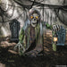 Full-length product photo of the 4 Ft. 10" Animated Light-Up Corroded Skeleton Reaper, shown against a plain white background — posed as an animated figure, with glowing light-up details. A Halloween decoration.
