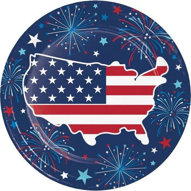 Round patriotic paper plate featuring a map of the United States filled with red and white stripes and white stars, surrounded by a navy blue border decorated with fireworks, stars, and patriotic colors.