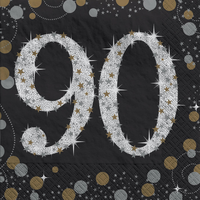Sparkling Celebration 90 Beverage Napkin with a large silver 90, gold and silver stars, sparkles, and confetti on a black background.

