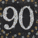 Sparkling Celebration 90 Beverage Napkin with a large silver 90, gold and silver stars, sparkles, and confetti on a black background.
