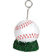 White baseball with red stitching on a green grass base, topped with a curved metal wire holder for photos or balloons.