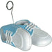 Pair of blue and white soft baby shoes with white laces attached to a curved metal wire holder with a spiral loop at the top for displaying photos or balloons.