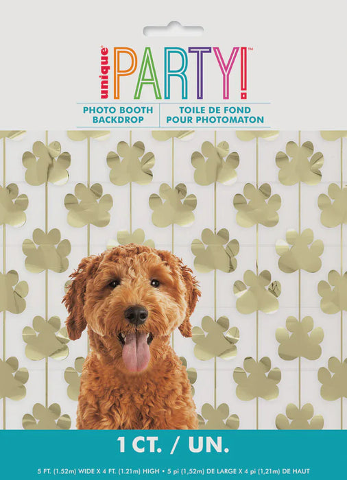 Dog photo booth backdrop with gold paw prints and 'Unique Party!' branding.