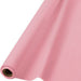 Roll of bright pink disposable table covering material with cardboard tube visible at one end.