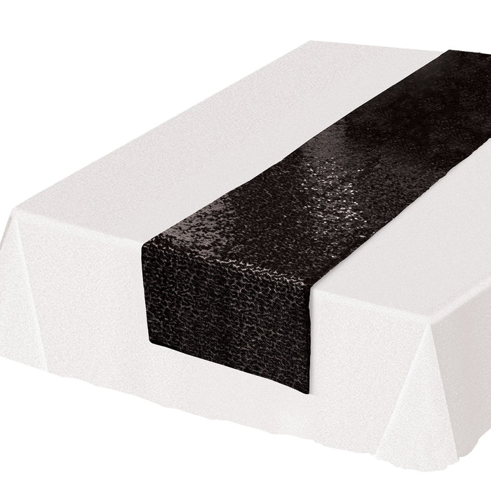 A sequined table runner. Sold as a single piece.