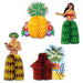 Four colorful honeycomb centerpieces featuring a yellow pineapple with green leaves, a hula dancer in red and green, a shirtless man in a yellow grass skirt, and a red tiki hut with surfboard and palm tree.