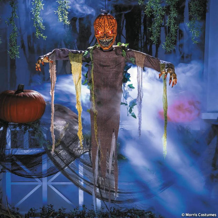 Full-length product photo of the 5 Ft. Light-Up Posable Hanging Pumpkin Patch Ghoul with Sound, shown against a plain white background — with glowing light-up details, built to play spooky sounds, designed to hang. A Halloween decoration.