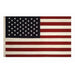 American flag with dark blue canton containing white stars and red and white stripes, displayed horizontally with two metal grommets for hanging.