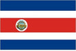 Costa Rican flag featuring three horizontal blue stripes with a wider red center stripe containing a circular seal, mounted on a wooden stick.