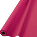 Rolled bright pink plastic table cover displayed showing the cylindrical roll with visible cardboard tube center.