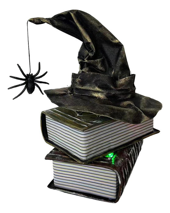 Full-length product photo of the Table Tp Witch Hat on Books Animated, shown against a plain white background — an animated, motion or sound-activated prop. A Halloween decoration.