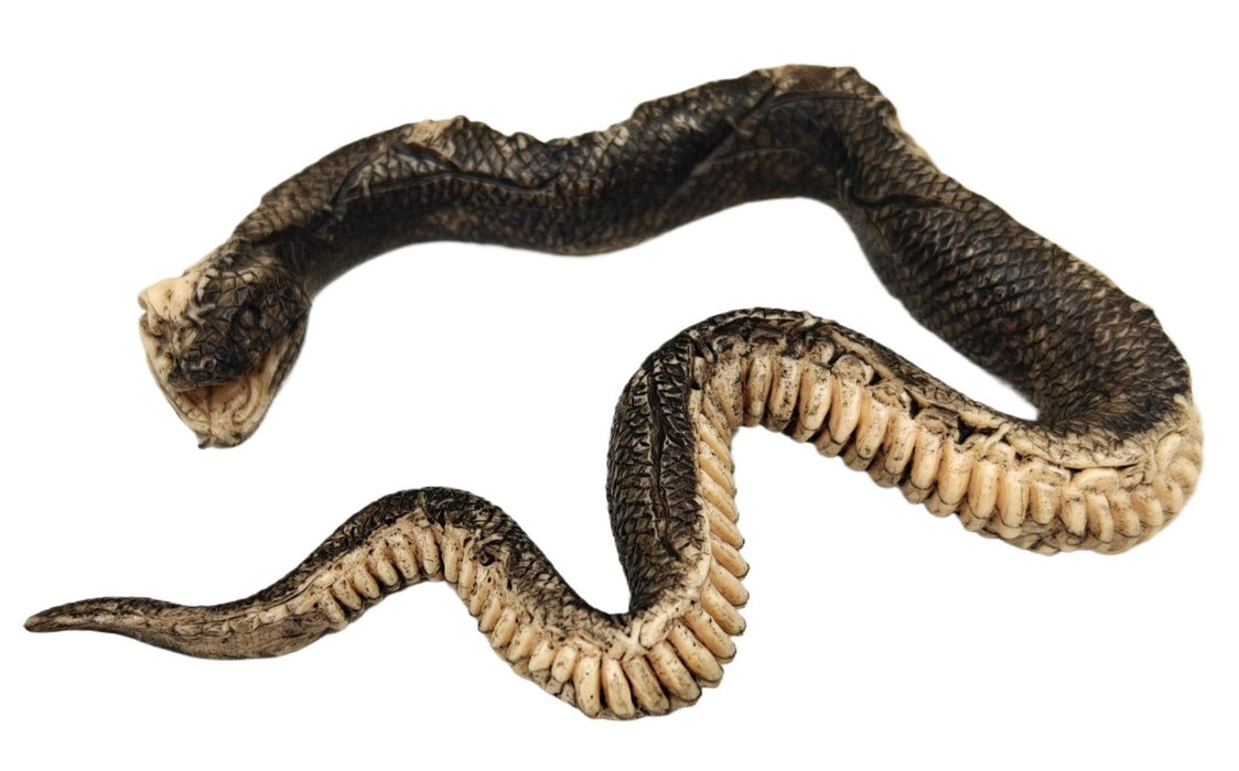 Full-length product photo of the 7" Rattan Skeleton Snake, shown against a plain white background. A Halloween decoration.
