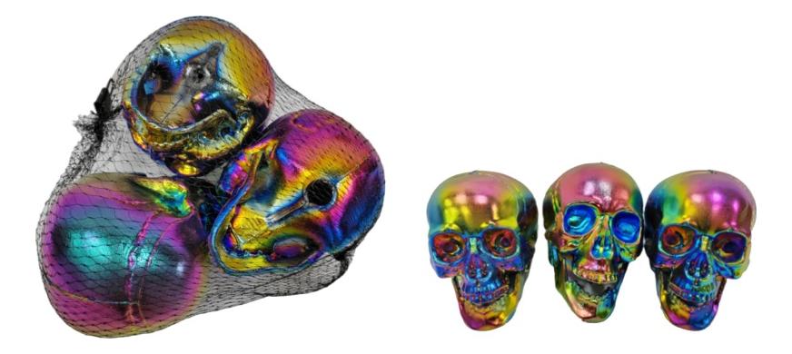 Full-length product photo of the 3 Piece Bag of 4" Iridescent Skulls, shown against a plain white background. A Halloween decoration.