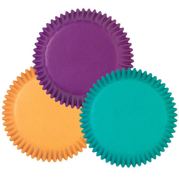 Three standard-size cupcake liners in jewel tones: purple, golden yellow, and teal, each with a fluted paper design arranged in an overlapping triangle composition.