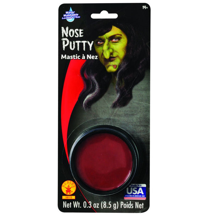 Black packaging with a green-faced witch character displays a dark red nose putty product in a circular container at the bottom.