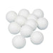 Twelve white ping pong balls clustered together against a white background.