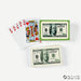 Playing cards and novelty dollar bill designs arranged in a fan display, showing hearts suit cards and $100 bill imagery in green and white packaging.