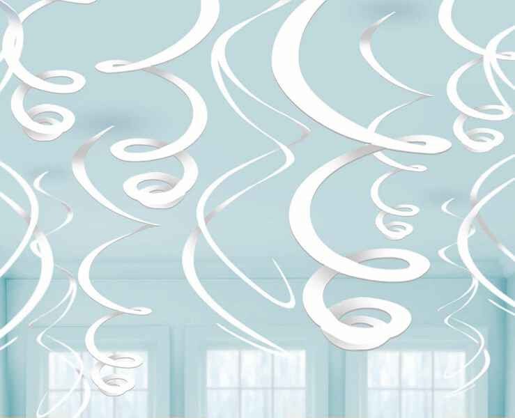 Twelve white spiral hanging decorations with swirled designs suspended against a light blue ceiling with windows visible below.