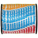 Colorful curling ribbon with diagonal stripes in orange, blue, and red sections, wound on a black spool.