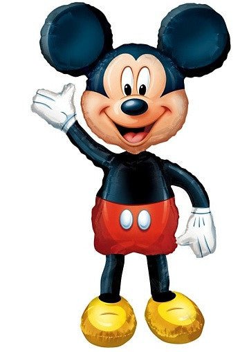 Classic cartoon character with round black ears, smiling face, black body, red shorts with white buttons, black legs, and yellow oversized shoes waving with white gloves.