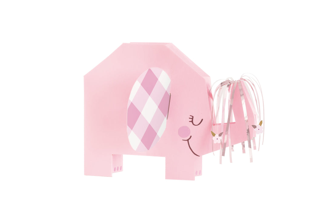Pink floral elephant centerpiece fold decoration with a gingham-patterned ear, smiling face, flower accents, and pink-and-silver fringe detail.