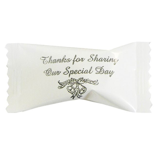 White wrapped buttermint candy with silver text reading "Thanks for Sharing Our Special Day" and decorative bells design.