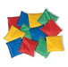 Twelve colorful fabric bean bags in red, blue, yellow, and green scattered on a white background.