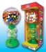 Vintage-style gumball machine with green plastic base, clear globe filled with colorful gumballs, and matching packaging box displayed side by side.