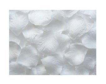Close-up view of approximately 400 white fabric rose petals scattered together, showing their soft textured surface and curved petal shapes.