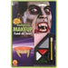 Vampire makeup kit packaging featuring pale face makeup, red lips, fangs, and applicator brush arranged on a card with a vampire character's face displayed above.