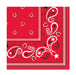 Red bandana-patterned paper napkins featuring white horseshoes, paisley designs with stars, and decorative borders arranged in a square layout.