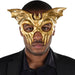 A man wearing a Adult Gold Winged Skull Plastic Half Mask.