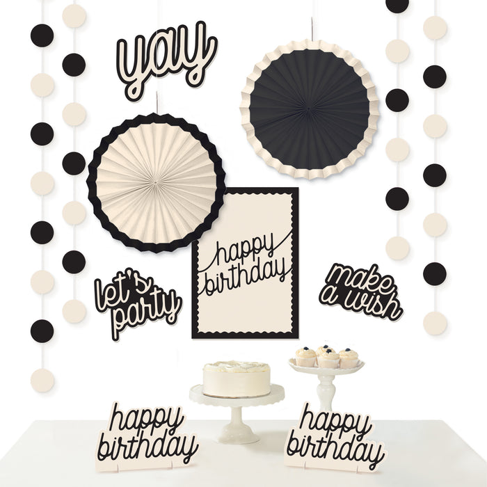 Birthday Chic Birthday Decorating Kit with black and cream paper fans, dot garlands, birthday signs, and tabletop cake decorations.