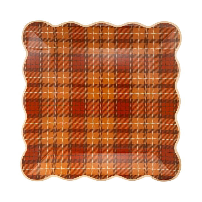 Plaid patterned paper plate on a white background