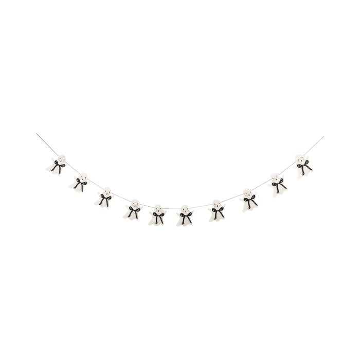 Decorative string with small black and white ghost figures on a white background