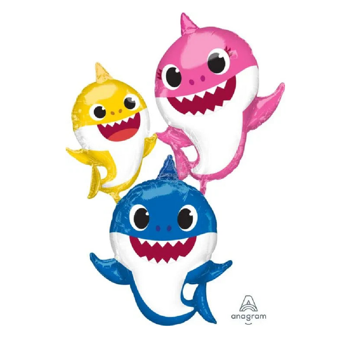Three smiling shark character balloons in yellow, pink, and blue stacked together with big eyes and open mouths showing teeth.