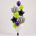 A Halloween-themed balloon bouquet featuring black and white striped pumpkins, black star balloons, purple and lime green balloons, and white balloons, arranged on a light gray background.