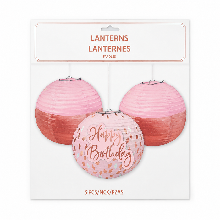 Blush Birthday Lanterns With Add-Ons featuring three pink paper lanterns, including a Happy Birthday design with blush and confetti-style accents, packaged as a 3-count set.
